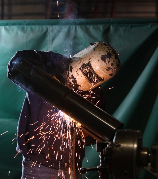 Man with welding helmet